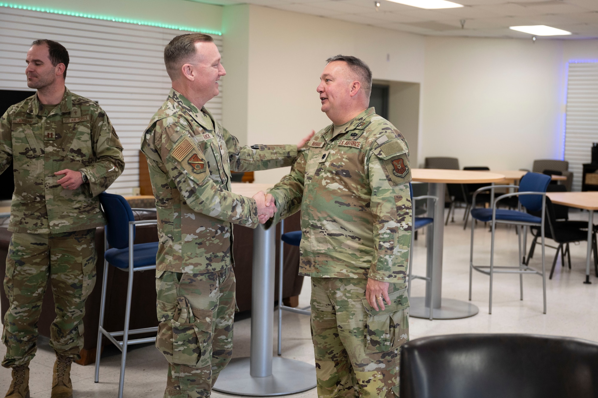 A man shakes hands with another man.