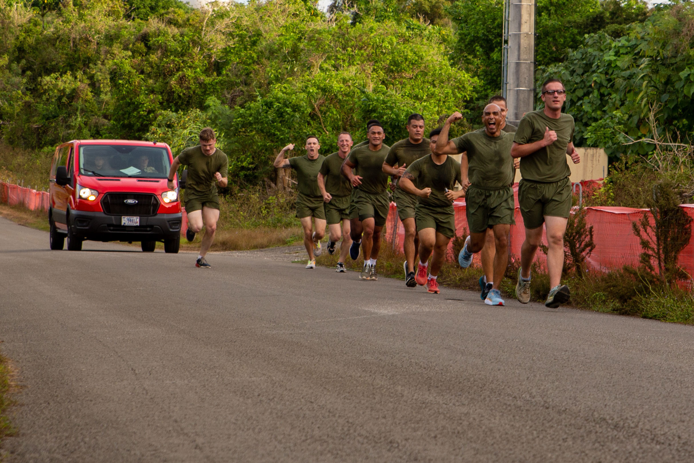 U.S. Marines and Sailors with Marine Corps Base Camp Blaz participate in a 3-mile back to front sprint for unit physical training on MCB Camp Blaz, Guam, Jan. 29, 2025. Marines and Sailors participated in a 3 mile back to front sprint, ab circuit, and conducted 200 pull-ups as a team to enhance unit cohesion and to promote physical fitness through competition. The unit PT was also conducted as a celebration of the two-year anniversary of the reactivation of Marine Corps Base Camp Blaz as the Marine Corps’ newest base. (U.S. Marine Corps photo by Lance Cpl. Afton Smiley)