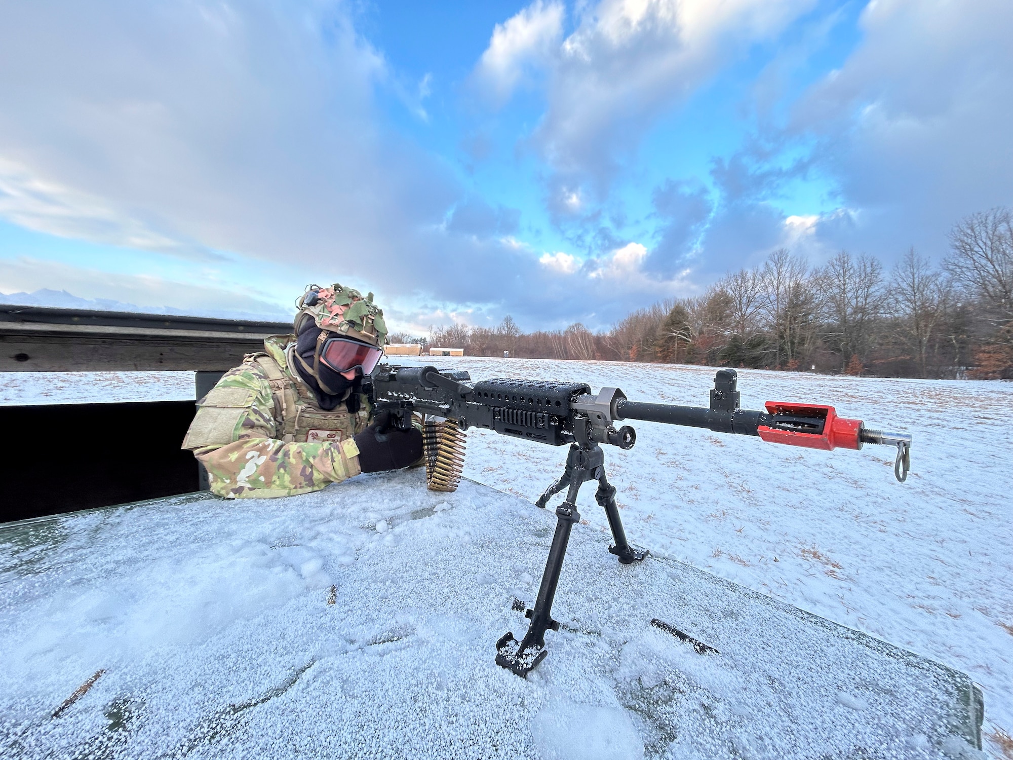 Airman aims his weapon