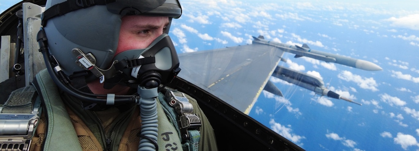U.S. Air Force Airman 1st Class Thomas Hansford, Aerial Combat Camera Journeyman, assigned to the 1st Combat Camera Squadron, Joint Base Charleston, South Carolina, prepares to document a formation flight inside an F-16D Fighting Falcon over the U.S. Indo-Pacific Command area of responsibility, Feb. 7, 2025,