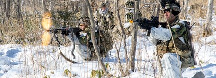 U.S. Army Pfc. Abraham Garcia (left) and Spc. William Sisk both infantrymen from Alpha Company, 1st Battalion, 5th Infantry Regiment participate in the culminating field training exercise during North Wind 25,