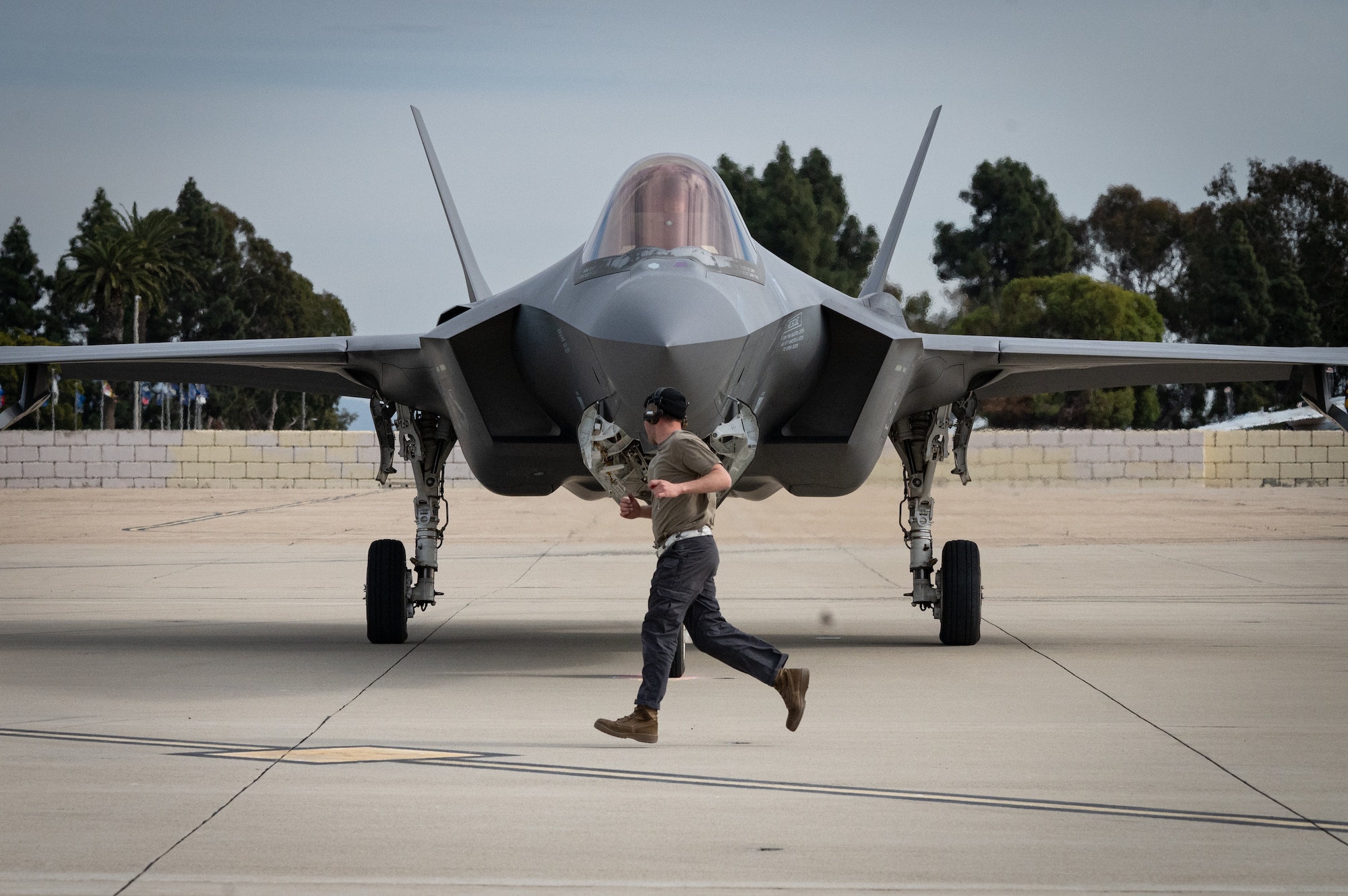 a photo of an F-35 maintainer working with an aircraft