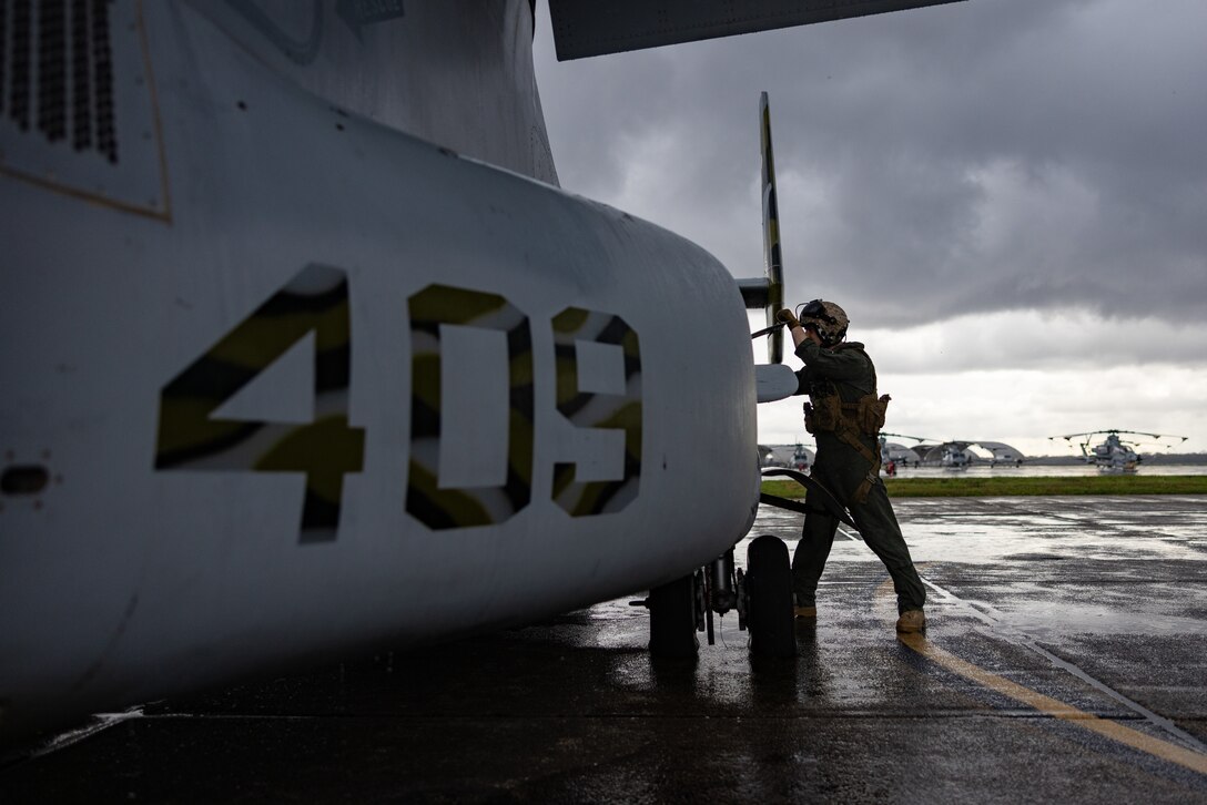 U.S. Marine Corps Maj. Nathan Sampson, a pilot with Marine Medium Tiltrotor Squadron (VMM) 774, Marine Aircraft Group 49, 4th Marine Aircraft Wing, inspects an MV-22B Osprey, tiltrotor aircraft, Naval Air Station Joint Reserve Base New Orleans, Belle Chasse, Louisiana, Feb. 9, 2025. The Marine Corps is the lead service for Super Bowl LIX flyover, participating in multiple events throughout the week exhibiting pride leading up to the U.S. Marine Corps 250th birthday. (U.S. Marine Corps photo by Sgt. Scott Jenkins)