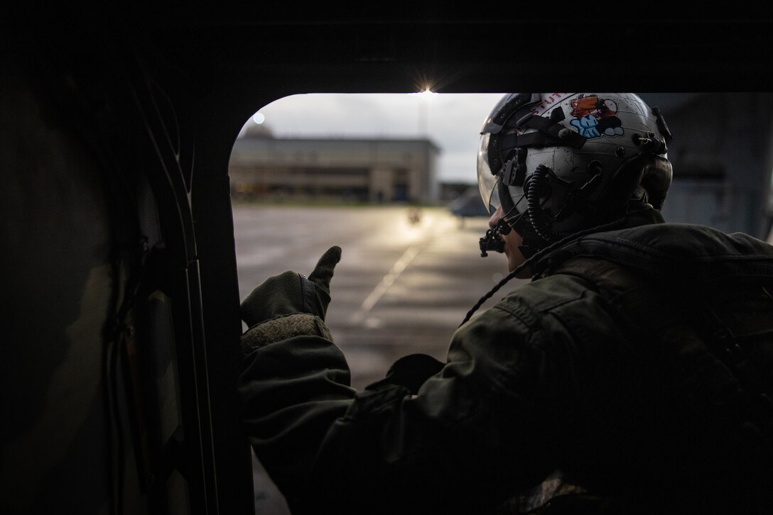 U.S. Marine Corps Cpl. Robert Huffstutler, a crew chief with Marine Medium Tiltrotor Squadron (VMM) 774, Marine Aircraft Group 49, 4th Marine Aircraft Wing, guides an MV-22B Osprey, tiltrotor aircraft, Naval Air Station Joint Reserve Base New Orleans, Belle Chasse, Louisiana, Feb. 9, 2025. The Marine Corps is the lead service for Super Bowl LIX flyover, participating in multiple events throughout the week exhibiting pride leading up to the U.S. Marine Corps 250th birthday. (U.S. Marine Corps photo by Sgt. Scott Jenkins)