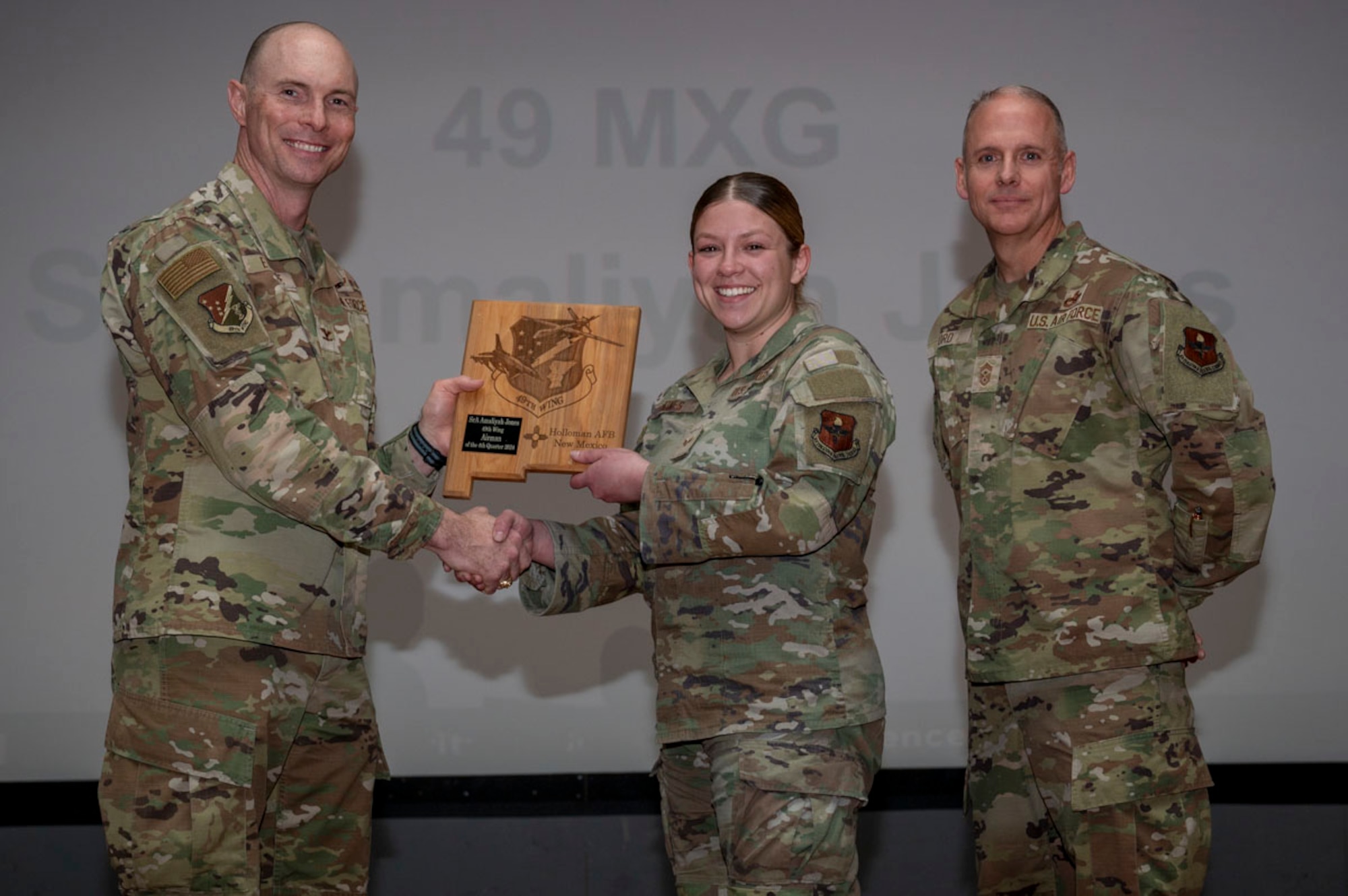 U.S. Air Force Senior Airman Amaliyah Jones, 8th Aircraft Maintenance Unit F-16 Electrical & Environmental journeyman, accepts the 49th Wing Airman of the Quarter Award, during the 49th Wing’s 4th Quarter Award ceremony a t Holloman Air Force Base, New Mexico, Feb. 7, 2025. Quarterly award winners were selected based on their technical expertise, demonstration of leadership and job performance. (U.S. Air Force photo by Senior Airman Michelle Ferrari)
