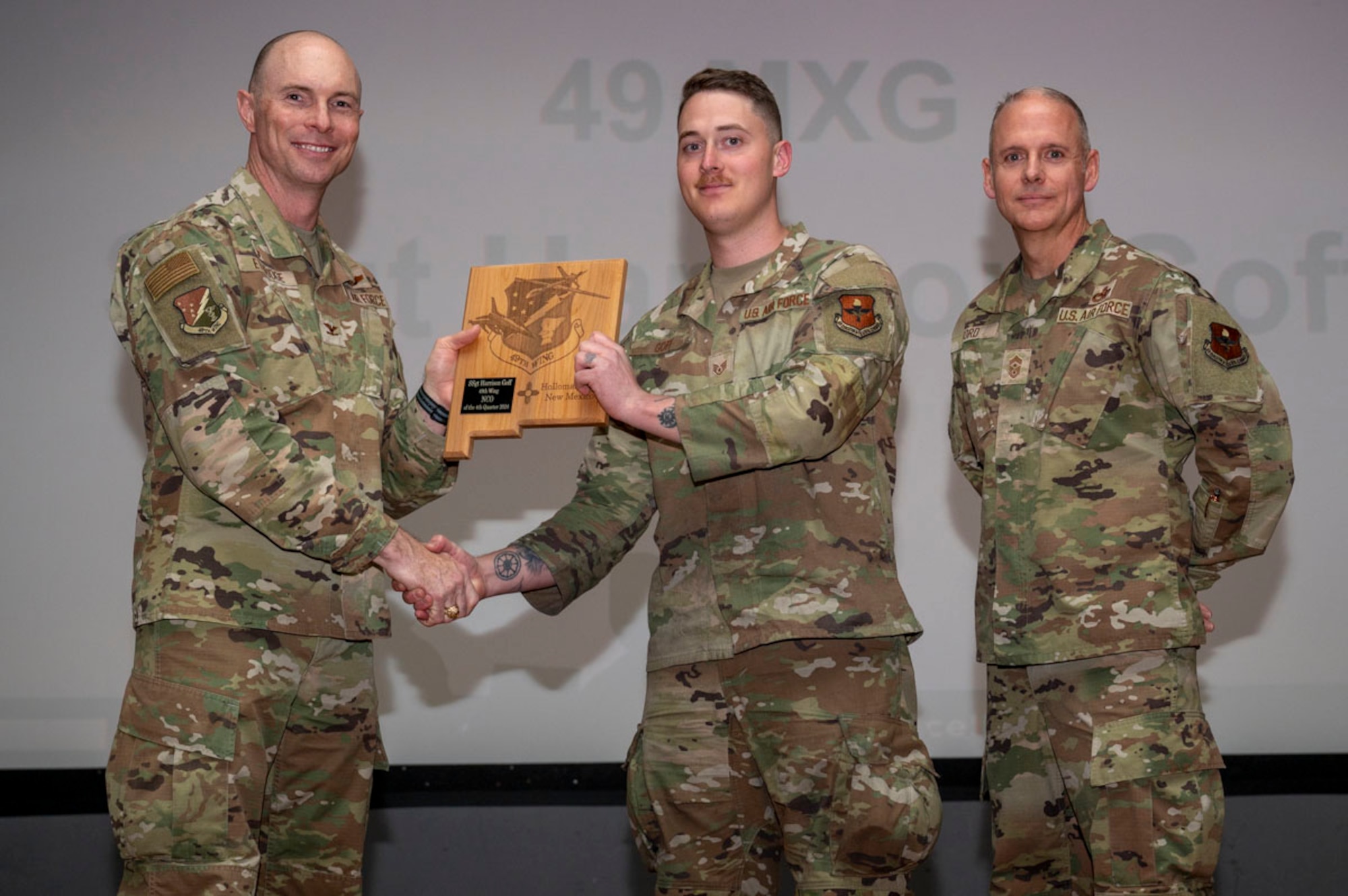 U.S. Air Force Staff Sgt. Harrison Goff, 49th Equipment Maintenance Squadron armament maintenance supervisor, accepts the 49th Wing Noncomissioned Officer of the Quarter Award, during the 49th Wing’s 4th Quarter Award ceremony at Holloman Air Force Base, New Mexico, Feb. 7, 2025. Quarterly award winners were selected based on their technical expertise, demonstration of leadership and job performance. (U.S. Air Force photo by Senior Airman Michelle Ferrari)