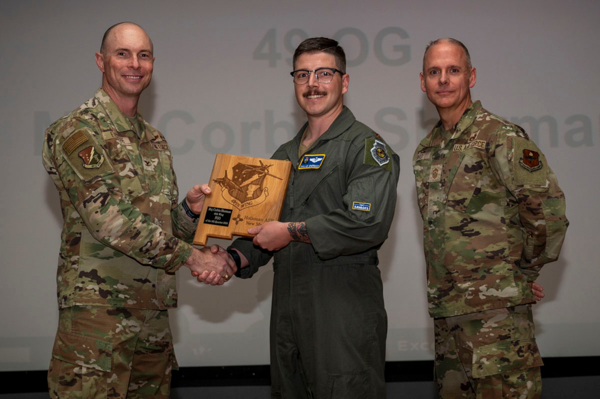 U.S. Air Force Maj. Corbin Sherman, 49th Operations Group MQ-9 weapons officer, accepts the 49th Wing Field Grade Officer of the Quarter Award, during the 49th Wing’s Feb. 7, 2025. Quarterly award winners were selected based on their technical expertise, demonstration of leadership and job performance. (U.S. Air Force photo by Senior Airman Michelle Ferrari)