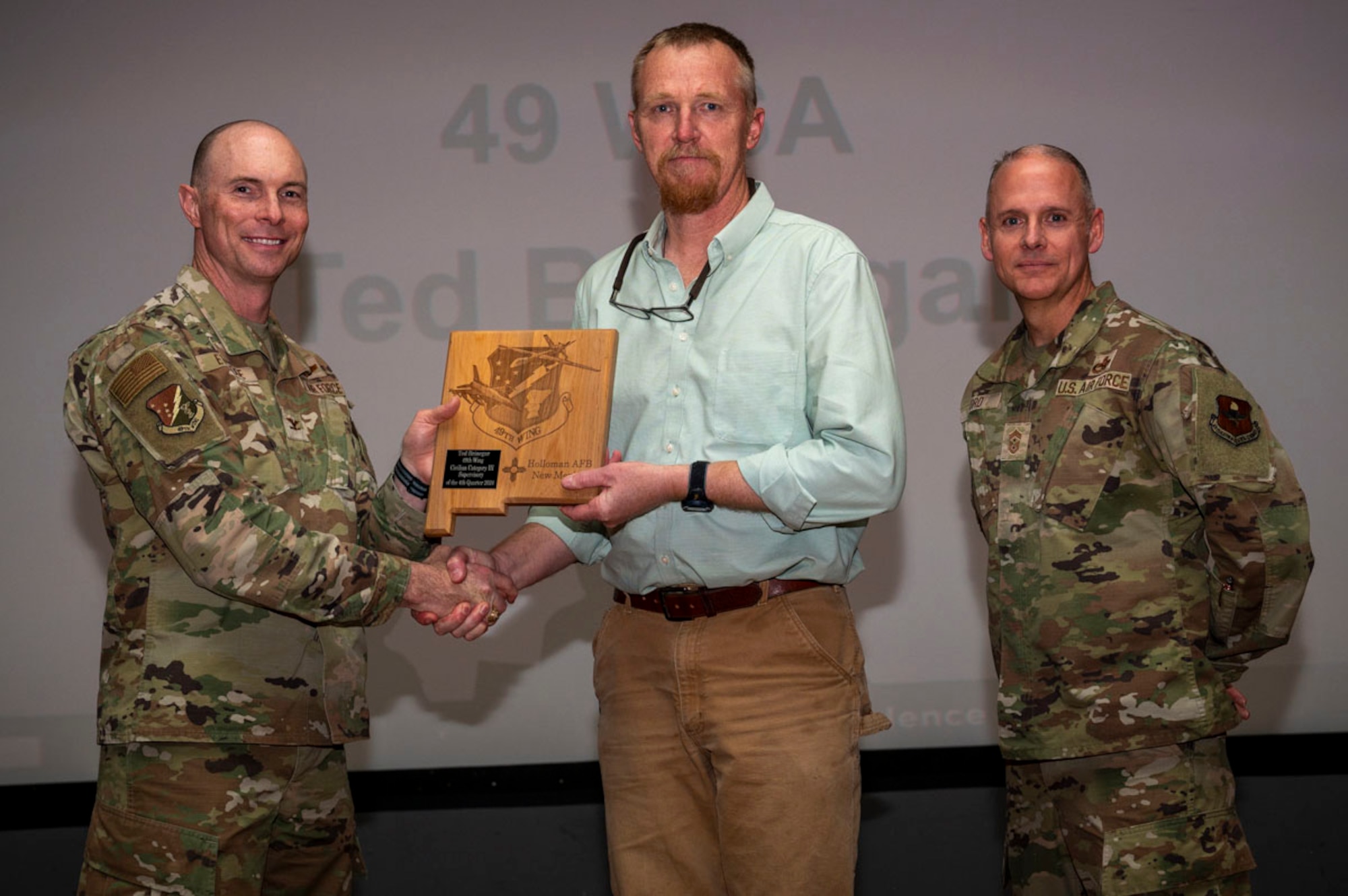 Ted Brinegar, 49th Wing Staff Agency Violence Prevention Program manager, accepts the 49th Wing Category III Supervisory Civilian of the Quarter Award, during the 49th Wing’s 4th Quarter Award ceremony at Holloman Air Force Base, New Mexico, Feb. 7, 2025. Quarterly award winners were selected based on their technical expertise, demonstration of leadership and job performance. (U.S. Air Force photo by Senior Airman Michelle Ferrari)