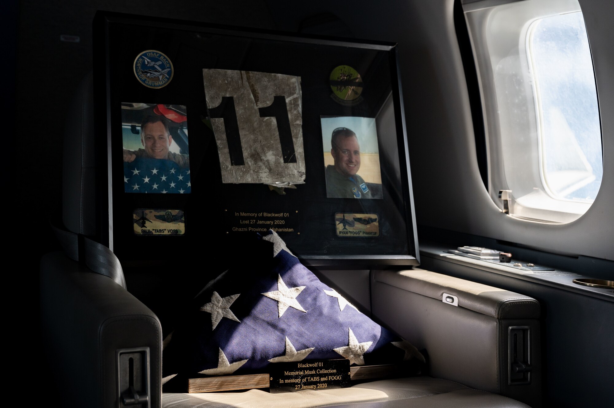 A memorial dedicated to U.S. Air Force Lt. Col. Paul “Tabs” Voss and Capt. Ryan “Fogg” Phaneuff flies in the back of an E-11A over the U.S. Central Command area of responsibility, Jan. 27, 2025, on the fifth anniversary of the tragic crash that claimed the pilots’ lives.