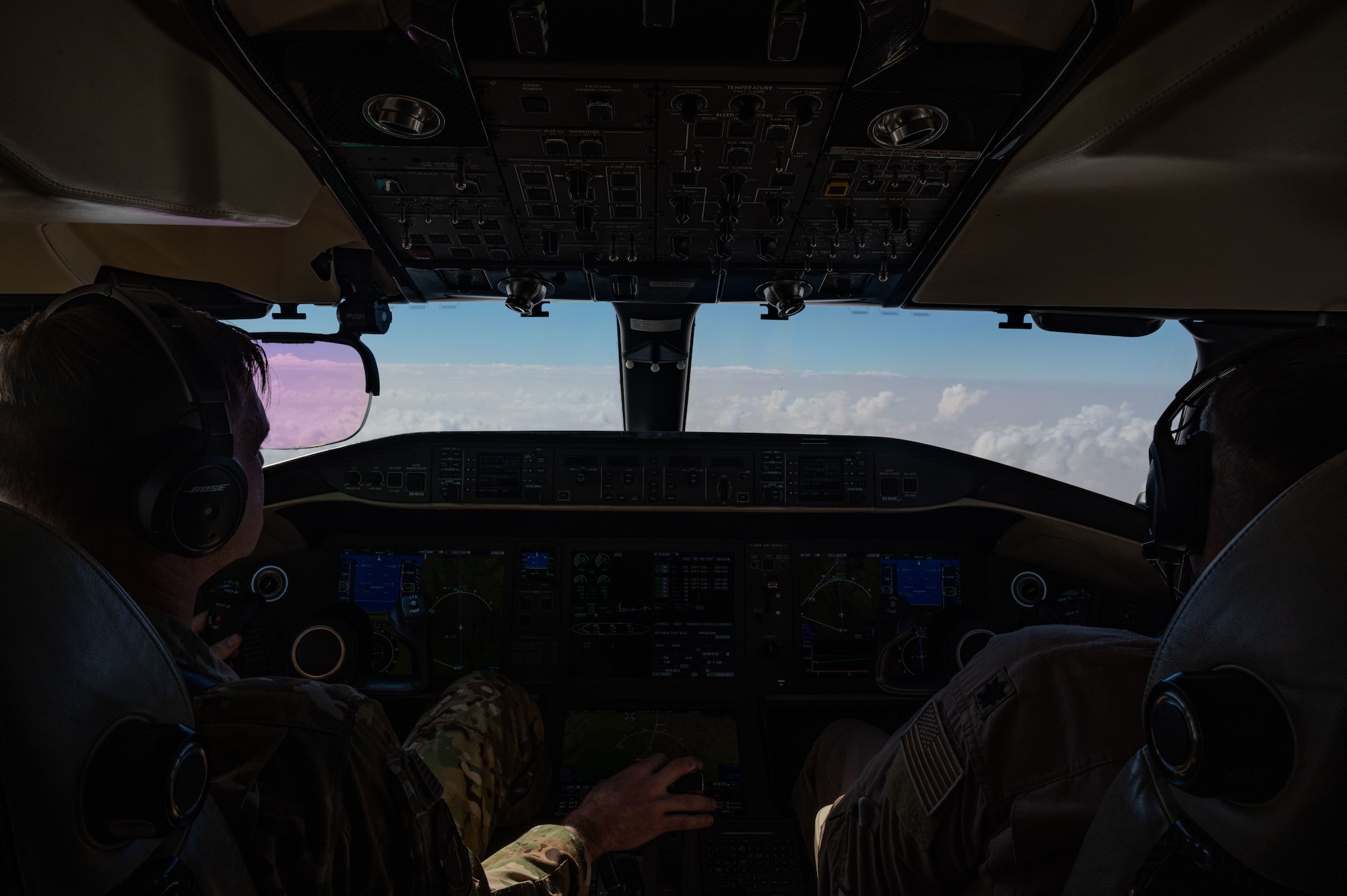 U.S. Air Force Lt. Col. Randell McCart (right), the 430th Expeditionary Electronic Combat Squadron commander, and Maj. Eric Goodman, a 430th EECS E-11A pilot, fly a memorial flight over the U.S. Central Command area of responsibility, Jan. 27, 2025, marking the 5th anniversary of an E-11A crash that claimed the lives of two 430th EECS pilots, Lt. Col. Paul “Tabs” Voss and Capt. Ryan “Fogg” Phaneuff.