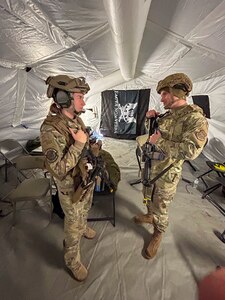 Two Airmen talking
