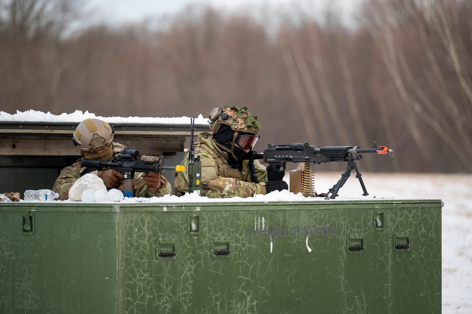 Airmen aim their weapons