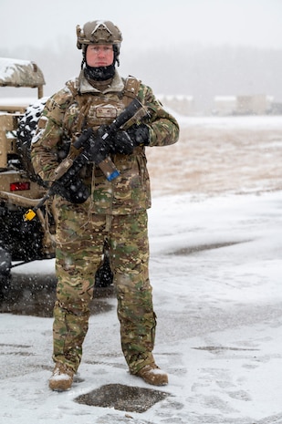 Airman stands guard