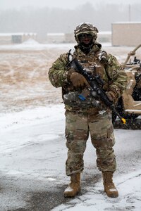 Airman stands guard at entry control point