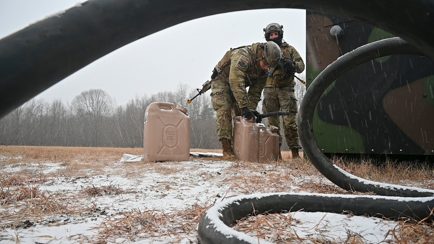 Airmen refuel a generator
