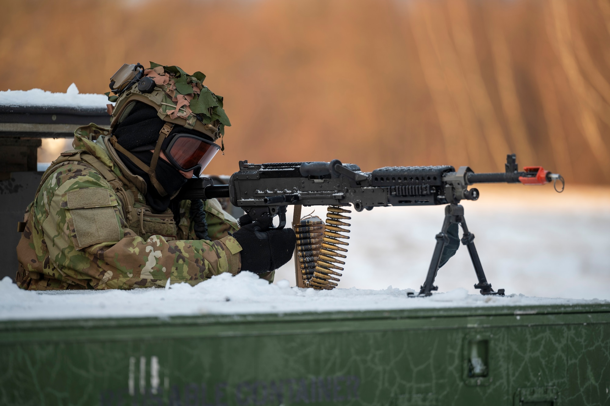 Airman aims his weapon
