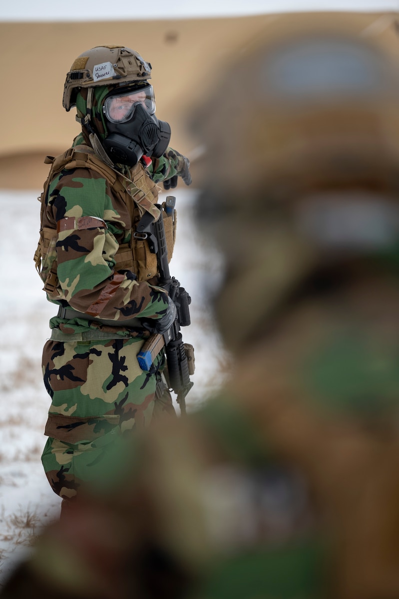 Airman directs another Airman