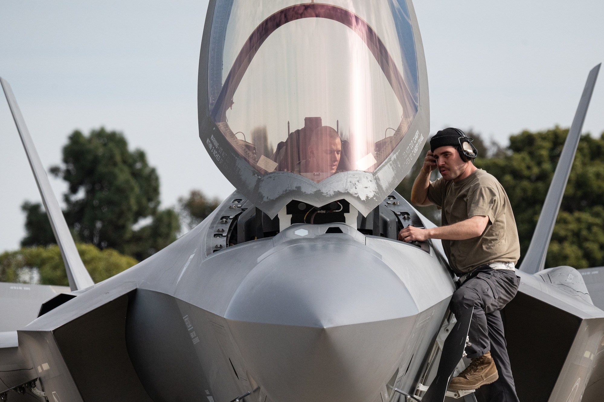 a photo of an F-35 maintainer working with an aircraft