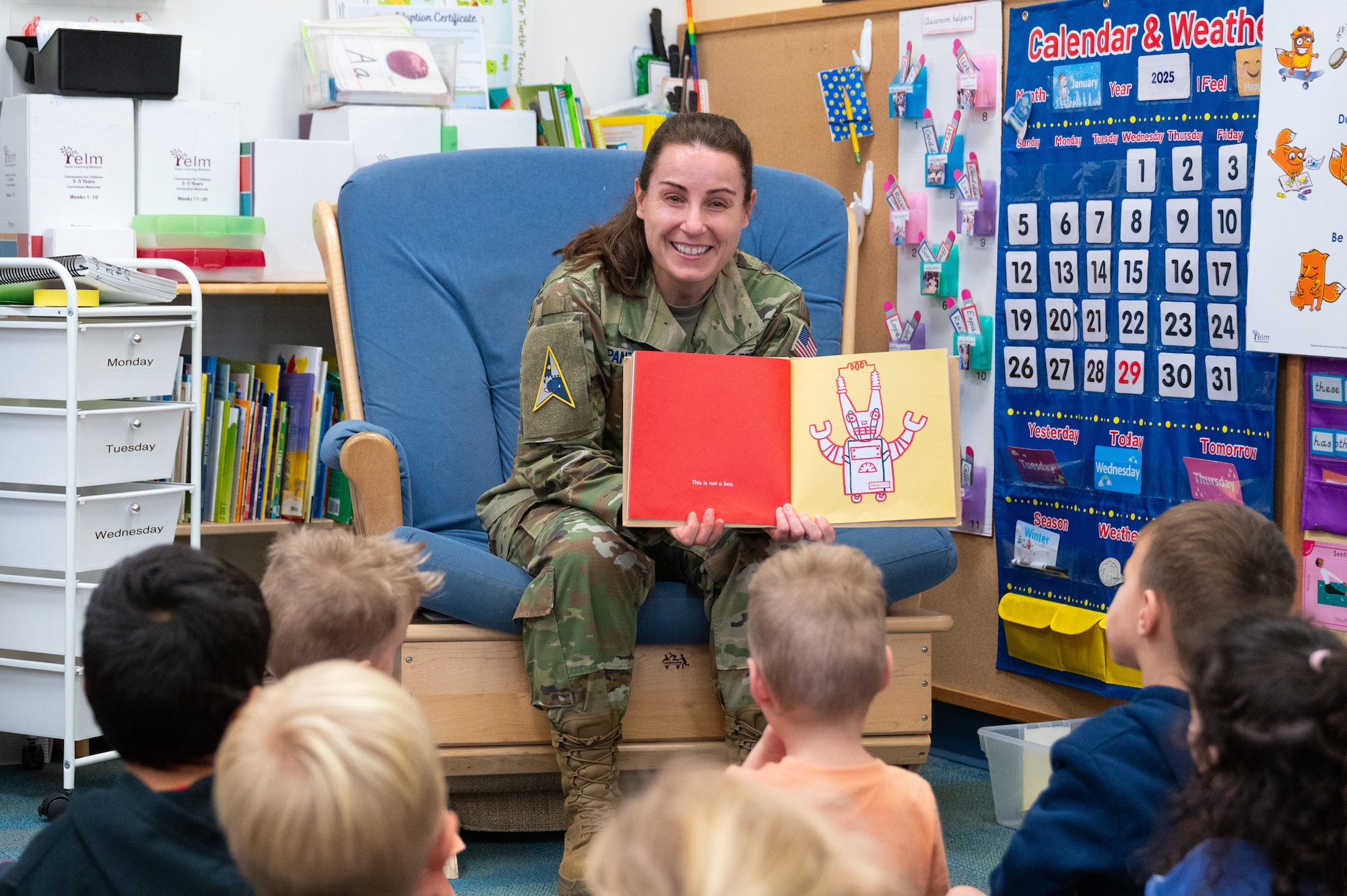 U.S. Space Force Brig. General Kristin Panzenhagen, Space Launch Delta 45 commander and Assured Access to Space program executive officer, reads a book to a group of children.