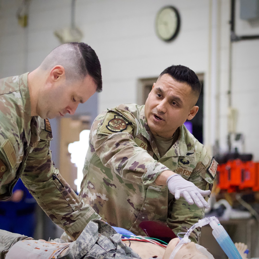 U.S. Air Force Capt. Steven Thompson, left, and Tech. Sgt. Carlos Patino, assigned to Detachment 1, Medical Group, 193rd Special Operations Wing, Pennsylvania National Guard, perform lifesaving techniques on simulated patients during a mass casualty exercise at Penn State Health Milton S. Hershey Medical Center in Hershey, Pennsylvania, Feb. 7, 2025. These Airmen completed an inaugural two-week training program, which is a new partnership between the National Guard and MSHMC, where participants learn how to respond effectively in emergencies and combat situations.