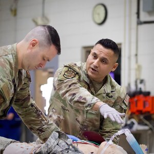 U.S. Air Force Capt. Steven Thompson, left, and Tech. Sgt. Carlos Patino, assigned to Detachment 1, Medical Group, 193rd Special Operations Wing, Pennsylvania National Guard, perform lifesaving techniques on simulated patients during a mass casualty exercise at Penn State Health Milton S. Hershey Medical Center in Hershey, Pennsylvania, Feb. 7, 2025. These Airmen completed an inaugural two-week training program, which is a new partnership between the National Guard and MSHMC, where participants learn how to respond effectively in emergencies and combat situations.