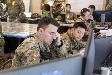 U.S. Army Soldiers with the New York National Guard’s 42nd Infantry Division relay command directives during the division’s Warfighter 25-3 exercise at Fort Indiantown Gap, Pa., Jan. 29, 2025. More than 1,300 National Guard Soldiers participated in the massive command post exercise, participating around the clock, making decisions involving logistics, intelligence, operations and tactics. (U.S. Army photo by Sgt. Grace Nechanicky, 42nd Inf. Div. public affairs)