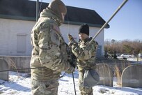 New York Army National Guard Soldiers assigned to Signal Intelligence and Sustainment Company, 42nd Infantry Division, set up radio communication devices Jan. 29, 2025, at Fort Indiantown Gap, Pa. The communication equipment was set up as part of the division’s Warfighter exercise in order to maintain unit readiness. (U.S. Army photo by Sgt. Grace Nechanicky)