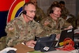 Maj. Gen. Jack A. James Jr. (left), the commander of the New York National Guard’s 42nd Infantry Division, conducts a commander’s update brief with the XVIII Airborne Corps during the division’s Warfighter 25-3 exercise at Fort Indiantown Gap, Pa., Jan. 30, 2025. The multi-day exercise, built around computer combat simulations against an experienced opposing force, tests the ability of division and brigade commanders and staff to conduct the tasks they would execute in battle. (U.S. Army photo by Master Sgt. Warren W. Wright Jr., 42nd Inf. Div. public affairs)
