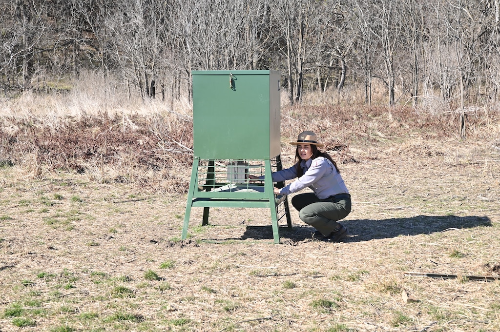 Elyssa Mendez, a park ranger with the U.S. Army Corps of Engineers, Fort Worth District’s Proctor Lake, checks on an automatic deer feeder in one of the many wildlife management areas that surround the lake. Mendez serves as the hunting coordinator for the lake and calls the outdoors her second office.