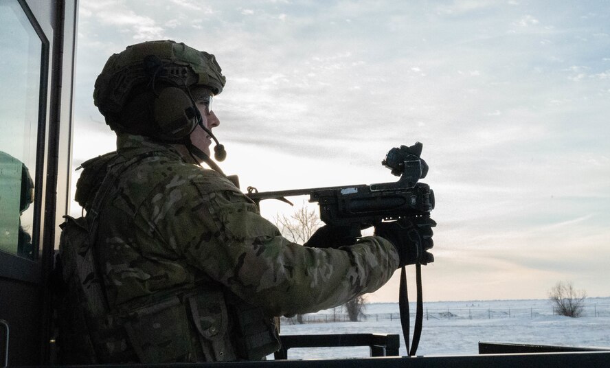 Senior Airman Jose Diaz, 91st Missile Security Operations Squadron defender, fires an M320A1 Grenade Launcher at Minot Air Force Base, North Dakota, Jan. 30, 2025. The M320A1 Grenade Launcher can be loaded with several types of ammunition depending on the situation. The M320A1 can also be mounted to another weapon to provide a more versatile weapon. (U.S. Air Force photo by Airman 1st Class Wesley Davies)