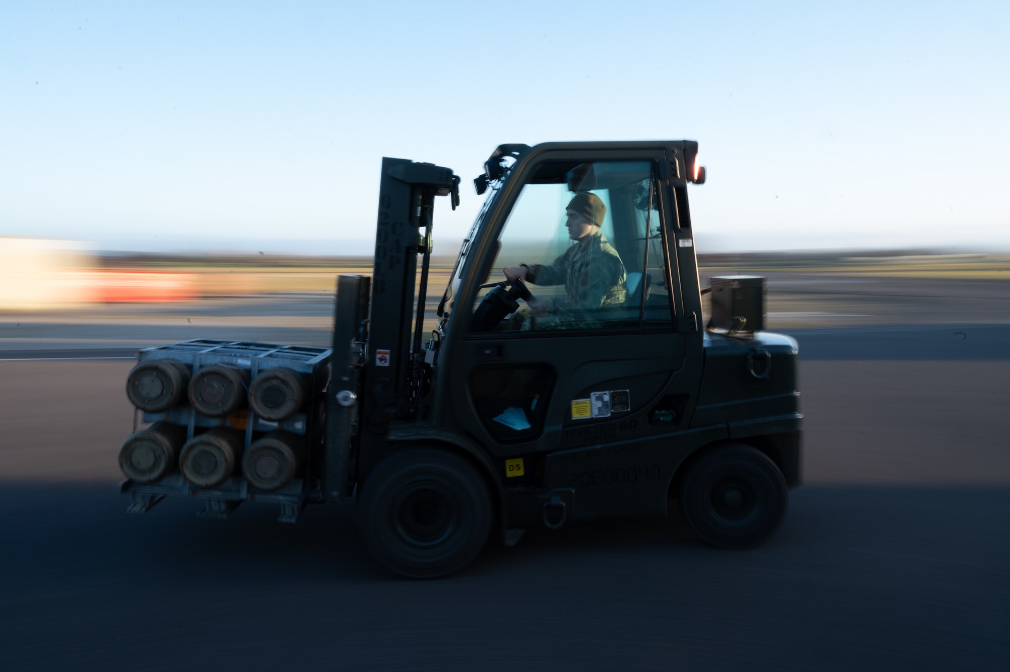 U.S. Air Force Senior Airman Braedon Naramore, 420th Munitions Squadron shipping and receiving technician, uses a forklift to carry munitions