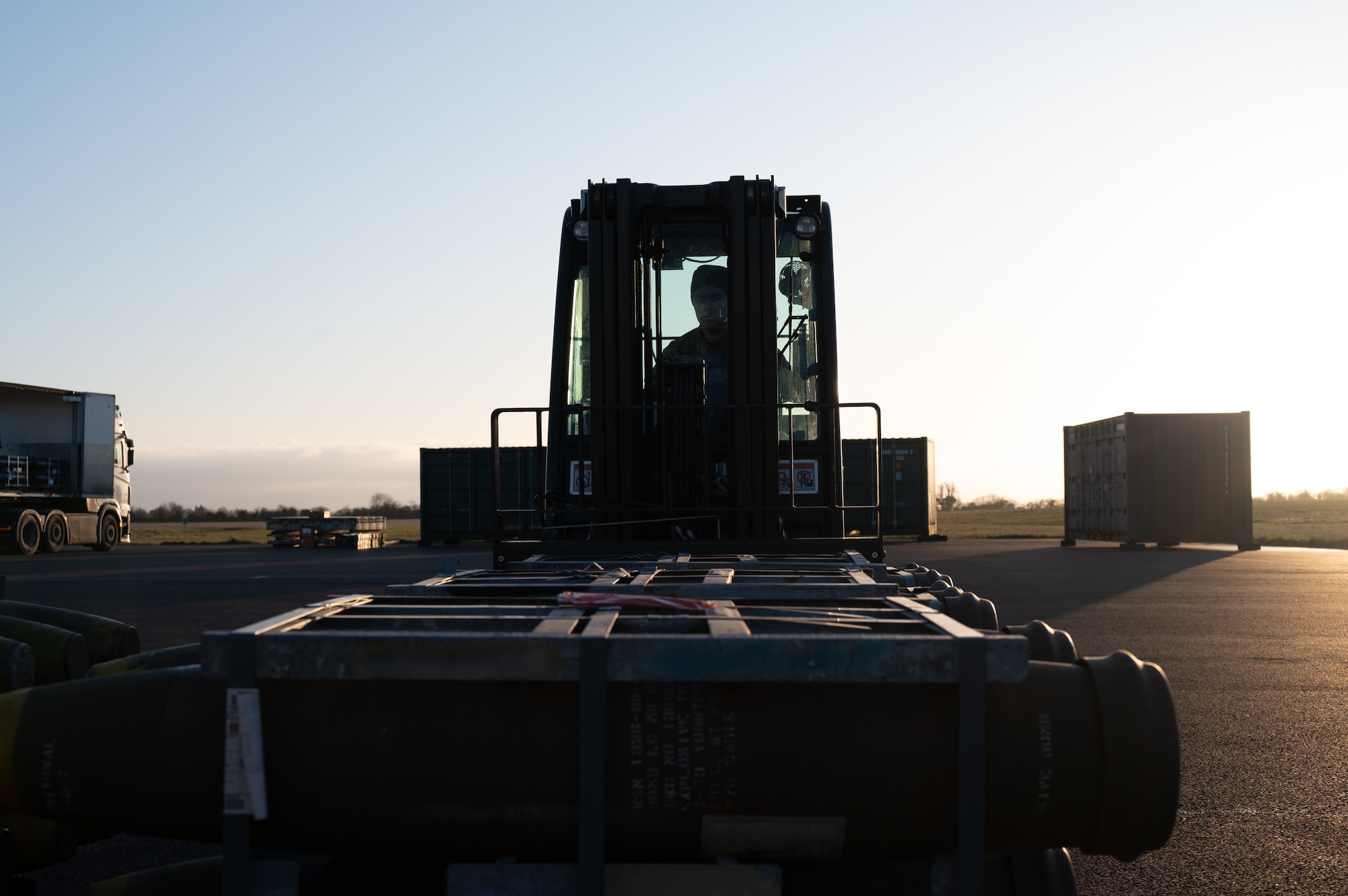 U.S. Air Force Senior Airman Braedon Naramore, 420th Munitions Squadron shipping and receiving technician, uses a forklift to carry munitions