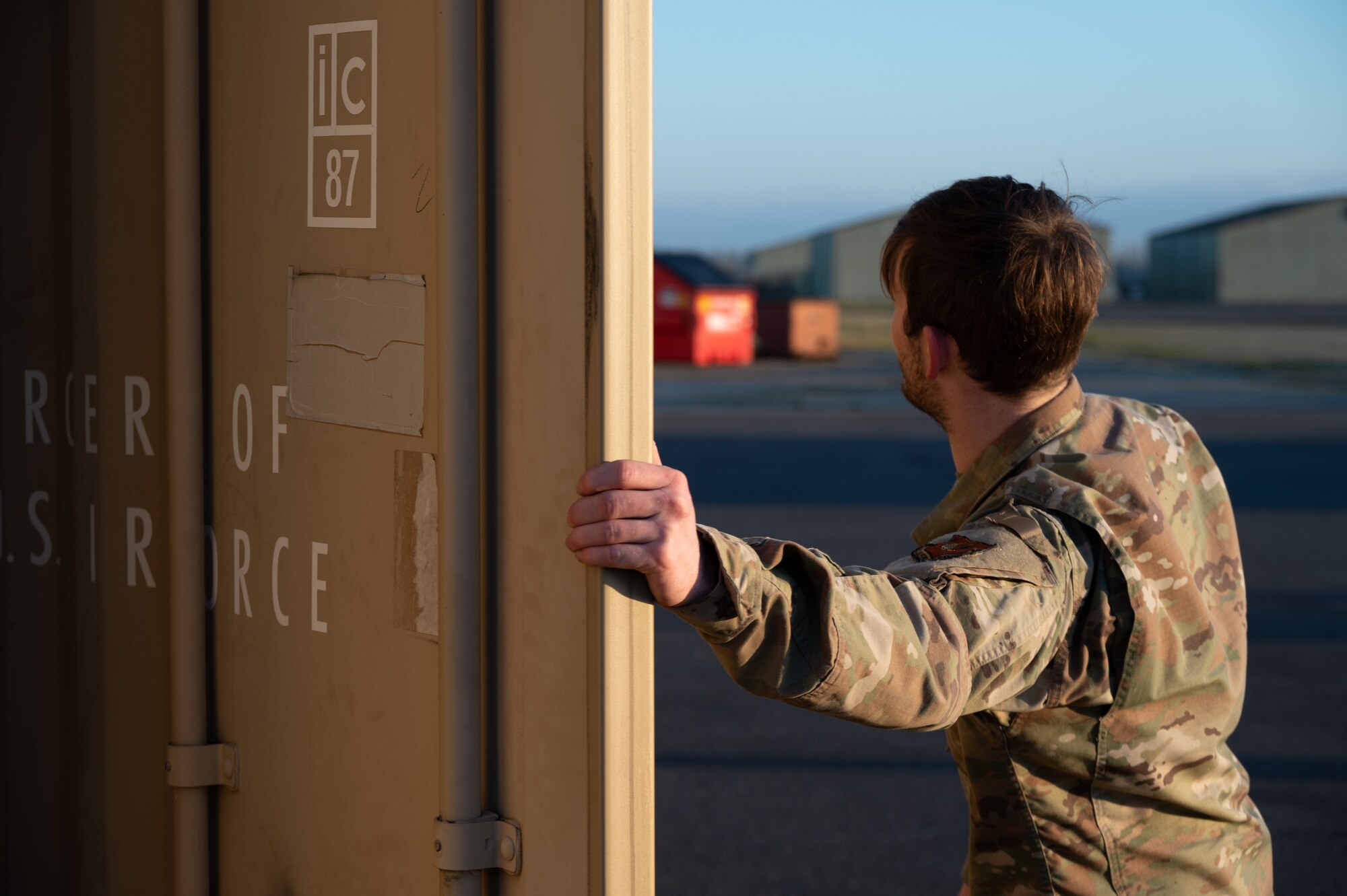 U.S. Air Force Senior Airman Zachary MacDonald, 420th Munitions Squadron shipping and receiving technician, opens a door in preparation of receiving munitions