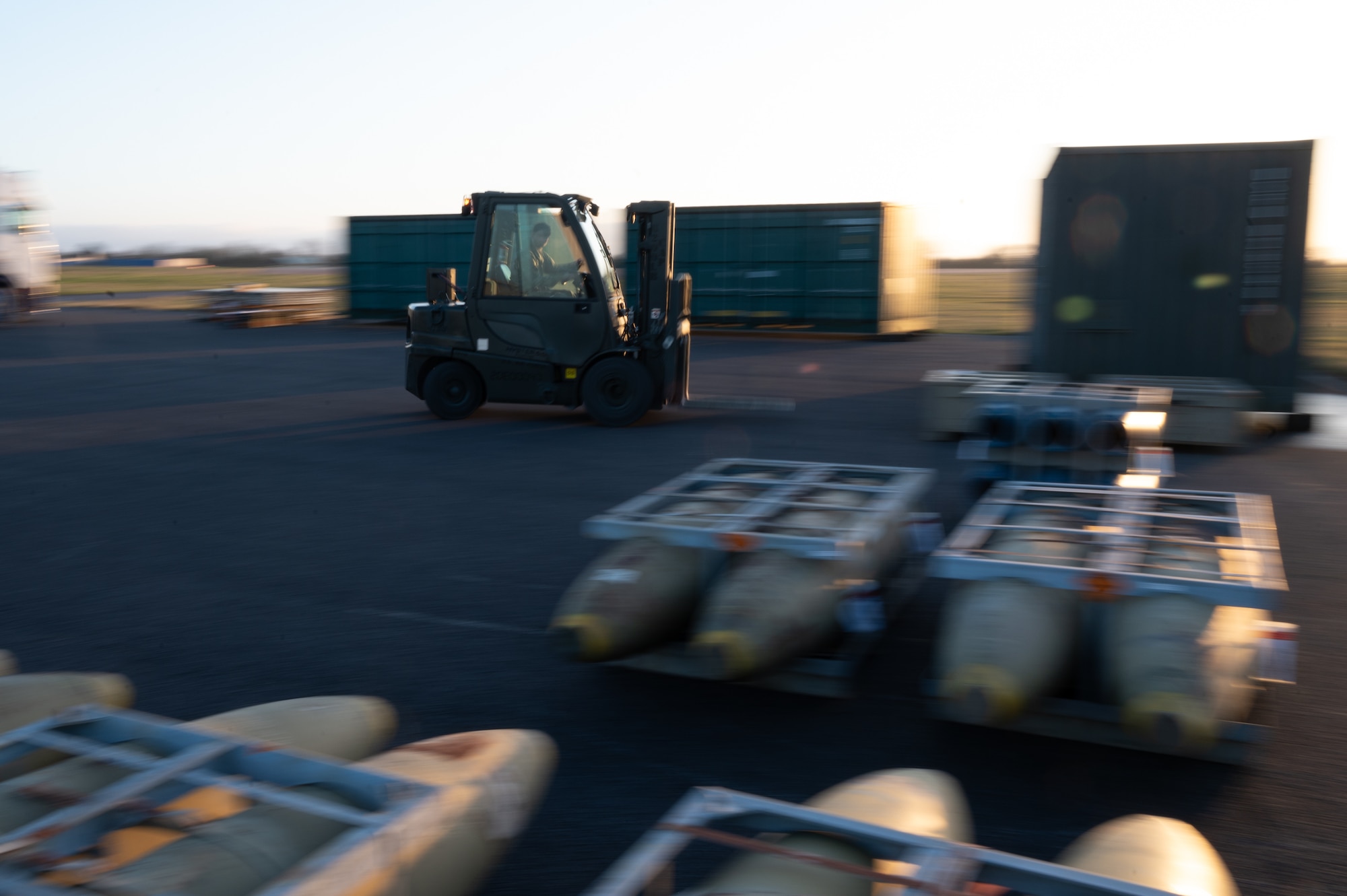U.S. Air Force Senior Airman Zachary MacDonald, 420th Munitions Squadron shipping and receiving technician, uses a forklift to carry munitions