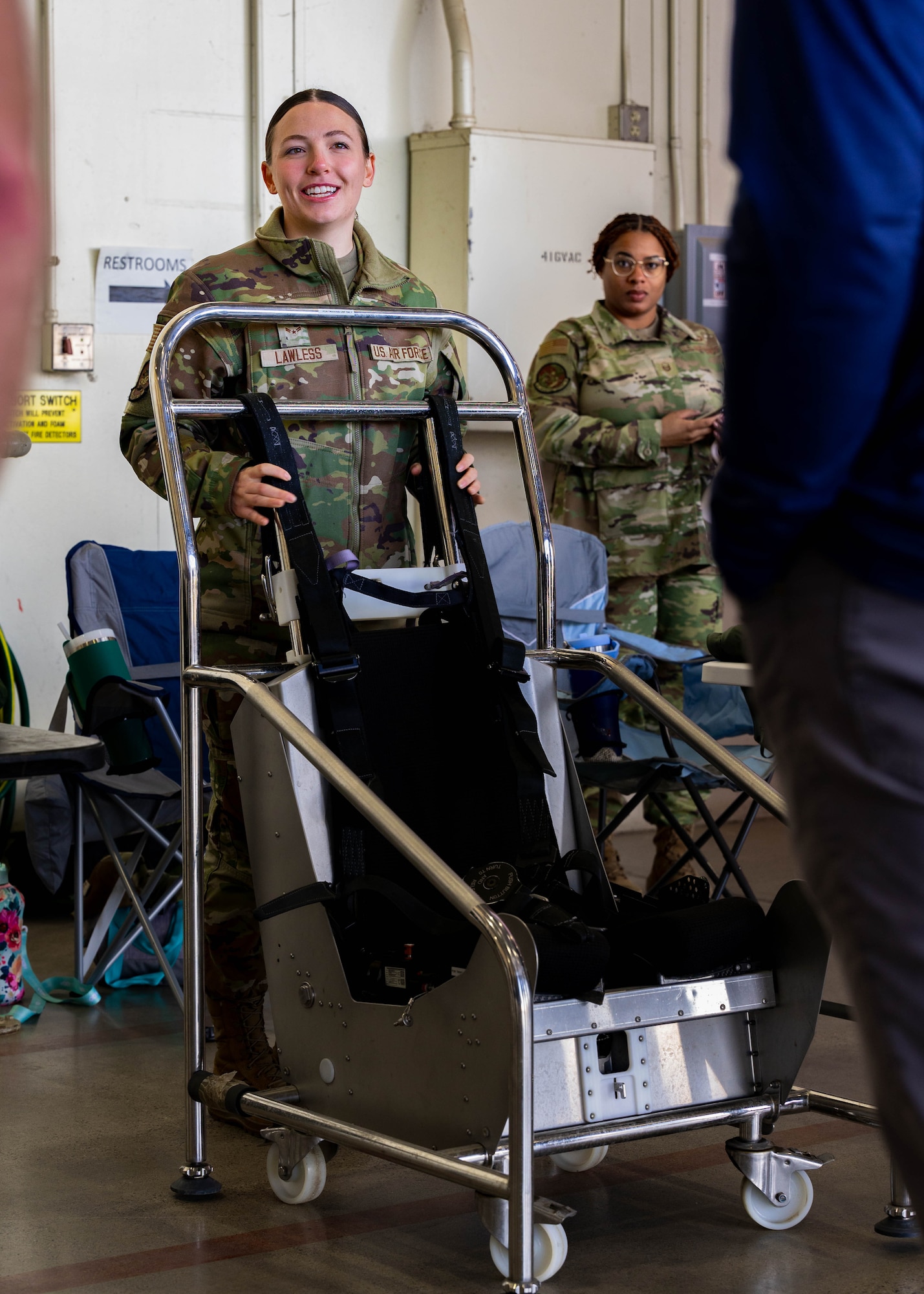 U.S. Air Force Airman 1st Class Ivy Lawless, 56th Operations Support Squadron aircrew flight equipment apprentice, briefs honorary commanders during an immersion tour.