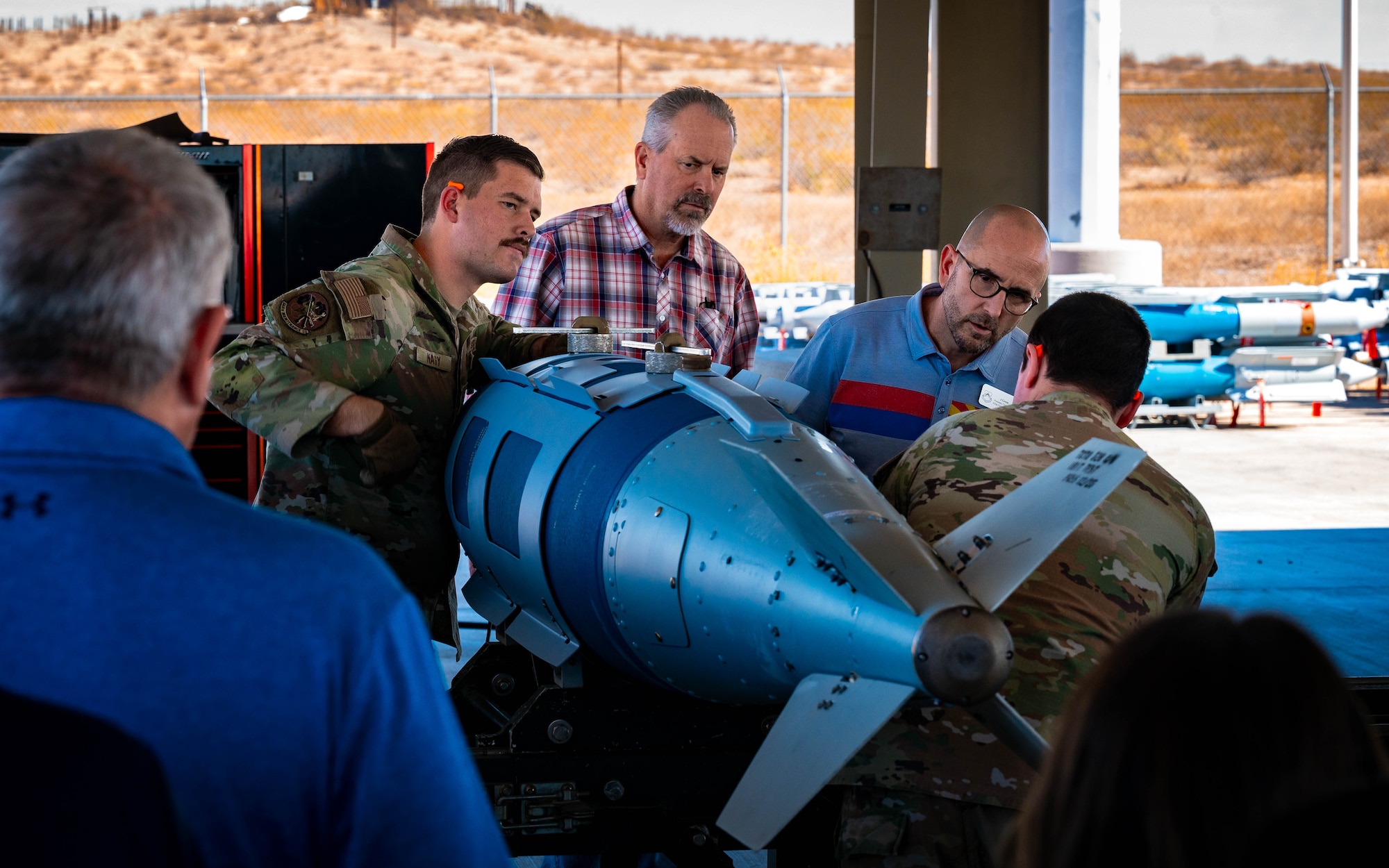 U.S. Air Force Airmen assigned to the 944th Fighter Wing and 56th Fighter Wing showcase ammunitions and related equipment during an immersion tour.