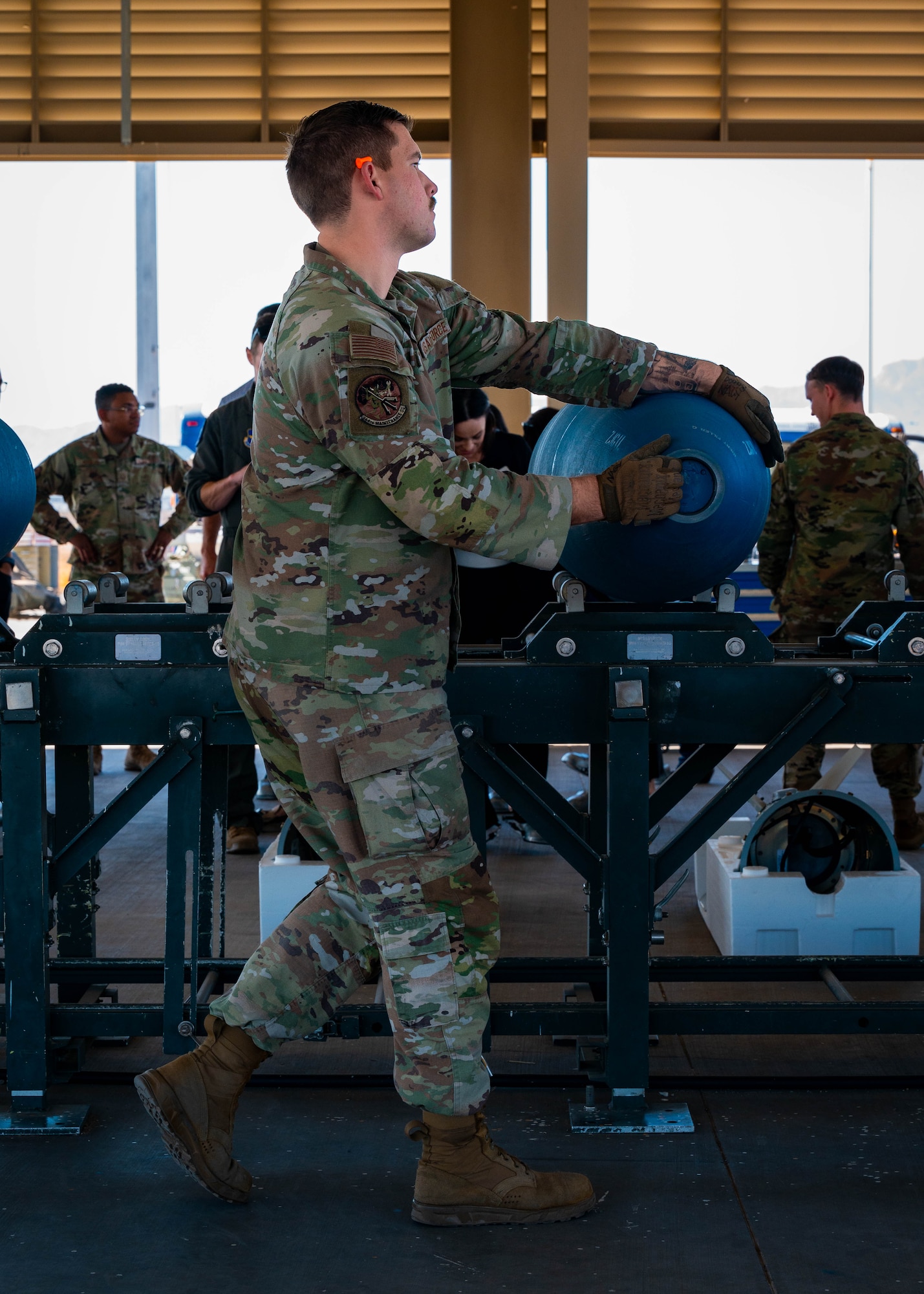 U.S. Air Force Staff Sgt. Hunter Nagy, 944th Maintenance Squadron conventional maintenance crew chief, moves a munition during an immersion tour.