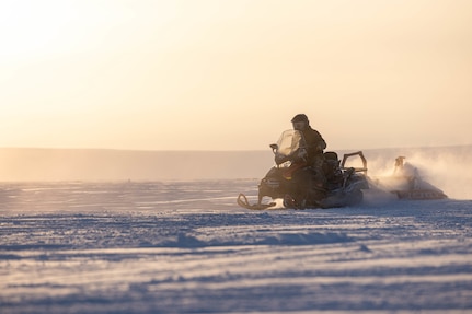 U.S. Air Force Tech. Sgt. Matthew Gadway, a member of the 109th Airlift Wing’s Polar Camp Skiway Team, grooms a ski landing area with a snow machine at Templeton Bay, Nunavut, Canada, March 13, 2023. The 109th’s LC-130's landed on the ski landing area to transport personnel and cargo to the austere Arctic environment during exercise Guerrier Nordique 2023.