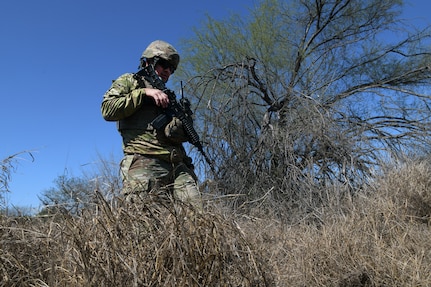 Texas Army National Guard Spc. Marc Lopez checks for migrant activity and evidence of illegal border crossings in a wooded area along the southern border near McAllen, Texas, as part of the Texas Tactical Border Force Feb. 03, 2025. The TTBF comprises Texas National Guard members in state active duty status who work with state and federal law enforcement officials, including U.S. Border Patrol, to deter, detect and stop illegal border crossings and to interdict transnational criminals.