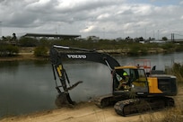 A Texas Army National Guard Soldier assigned to the Texas Tactical Border Force clears brush and shores up the edge of a path along the U.S. side of the Rio Grande River near Roma, Texas, to aid U.S. Border Patrol's ability to move throughout the area and monitor for illegal border crossings Feb. 5, 2025.