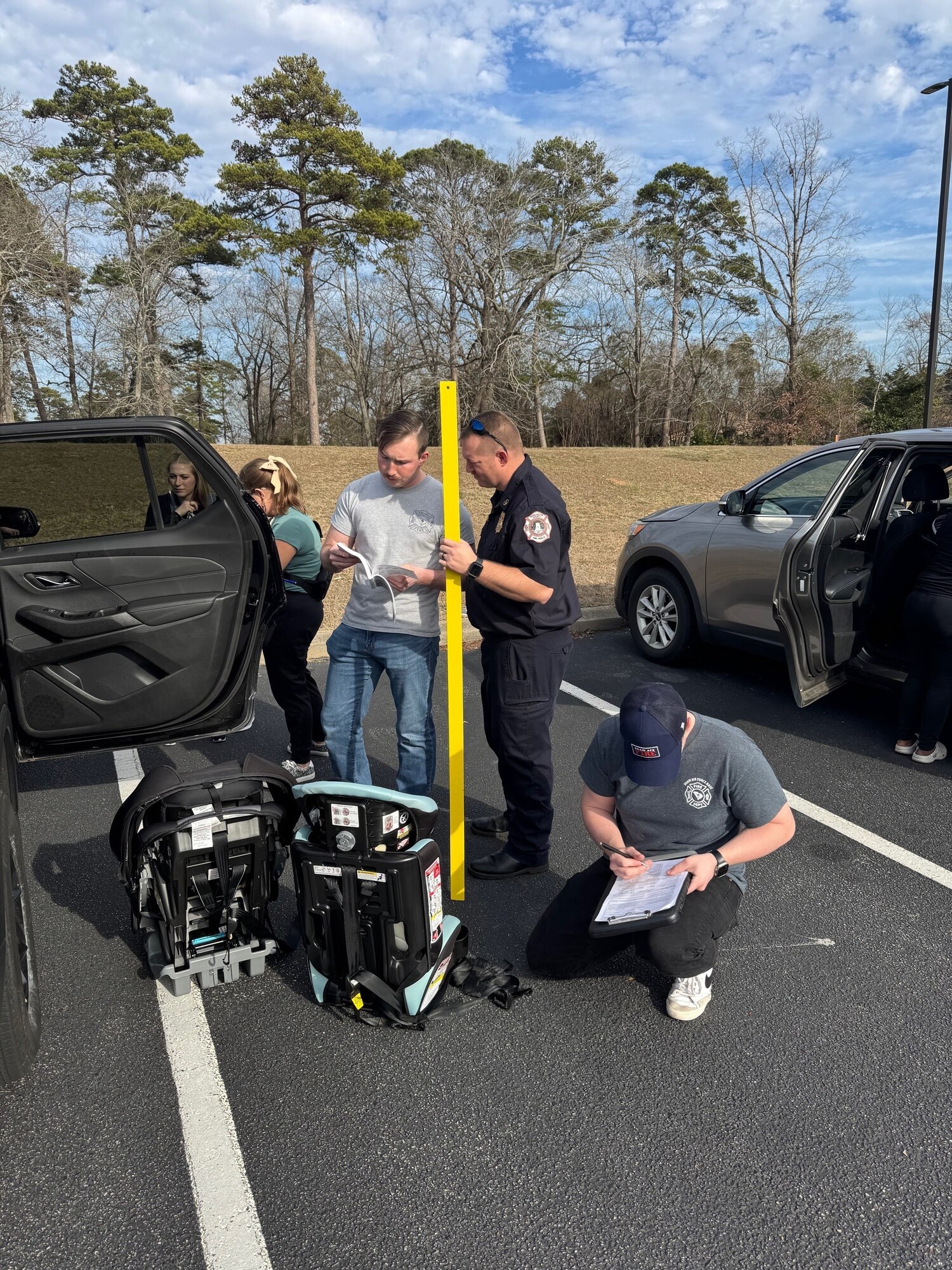 U.S. Air Force Senior Airmen Logan Smith, right, and Christian Moneypenny, left, 20th Civil Engineer Squadron Fire and Emergency Services operators, learn how to inspect car seats during a week-long Child Passenger Safety Technician class at Shaw Air Force Base, S.C., Jan. 31, 2025. Smith and Moneypenny, along with 14 other personnel from the 20th CES FES, Lexington Fire, Dorchester County Fire, Lexington and Sumter County Sheriff’s Office, and Prisma Health, were added to the ranks of the 1,100 current CPSTs in the state of South Carolina. (Courtesy photo)