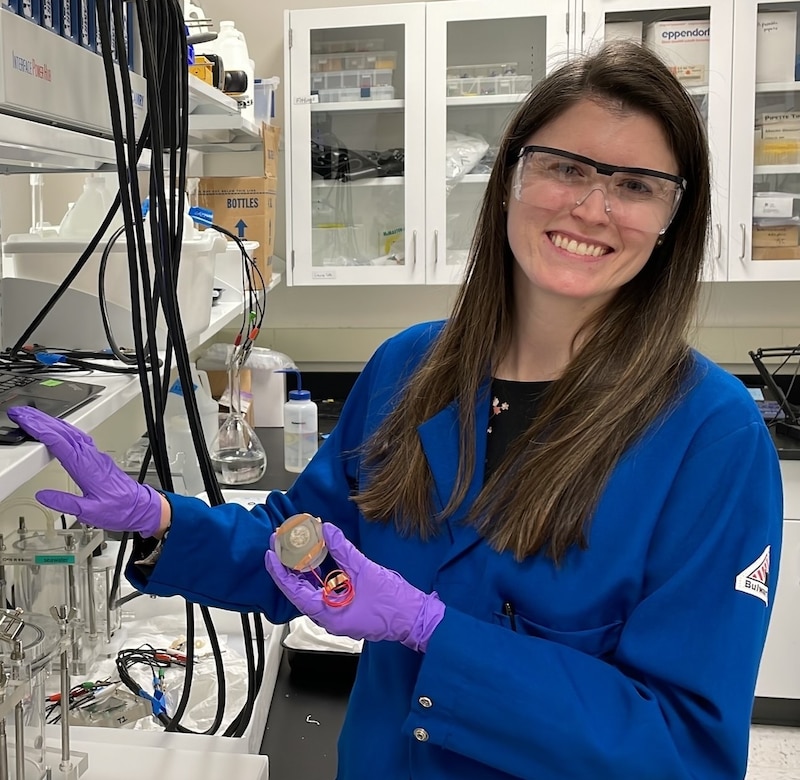 Woman smiling in a laboratory