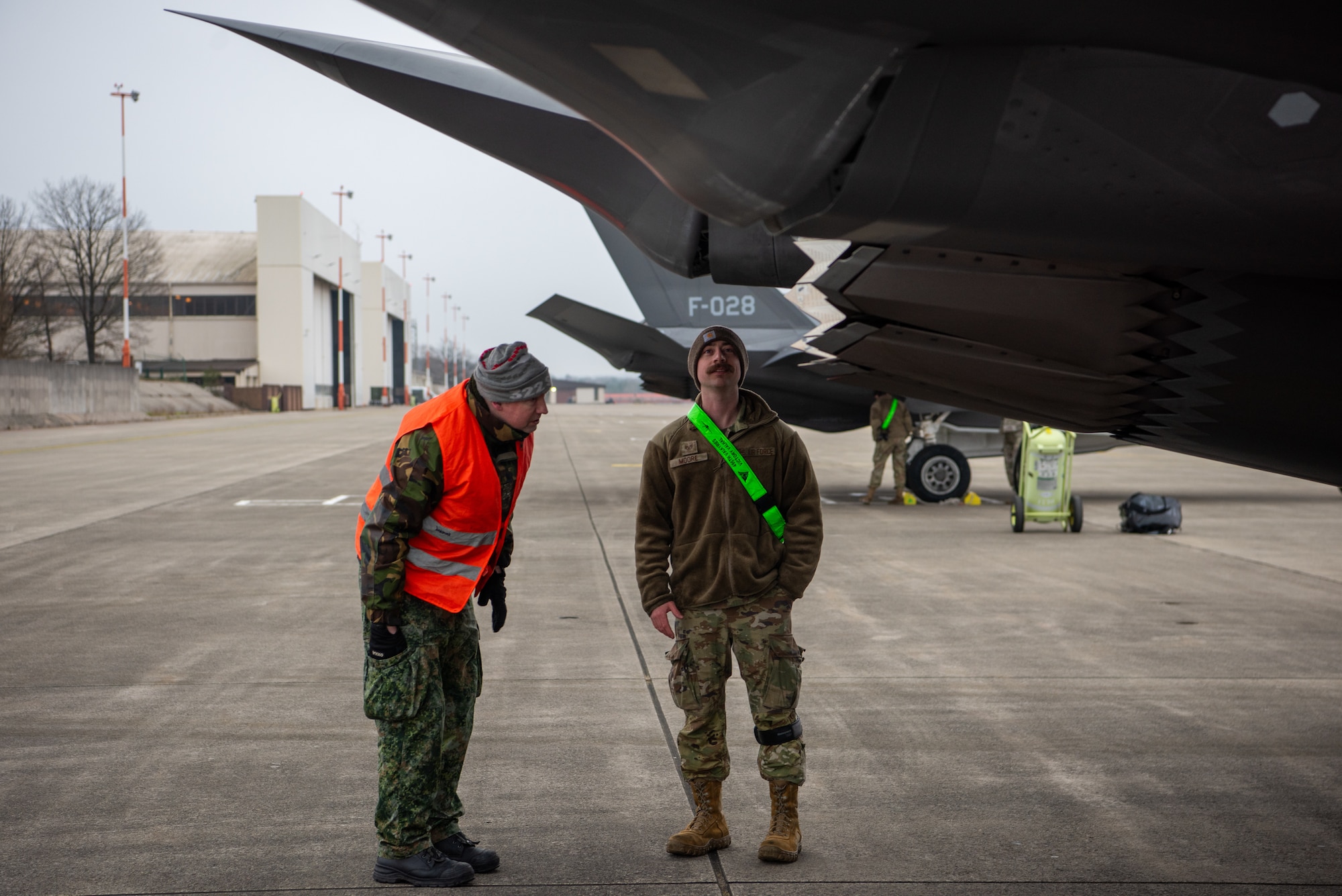 Airmen check an F-35.