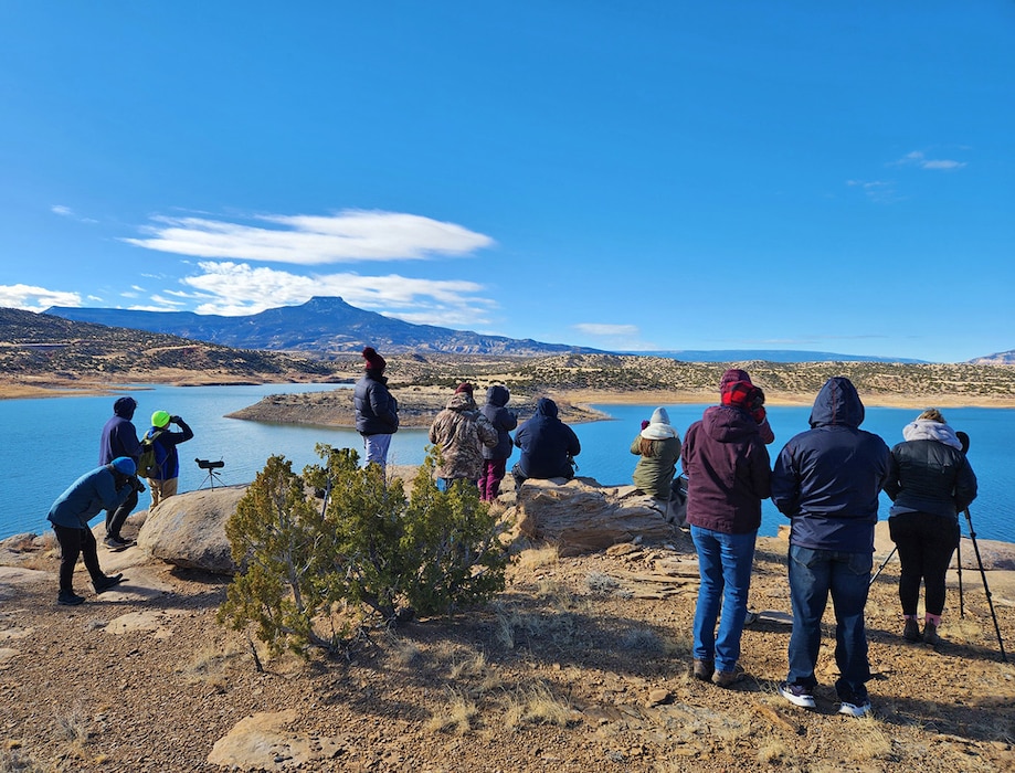 Volunteers look for eagles at one of the fixed observation points look for eagles during the Abiquiu Lake eagle watch, Jan. 11, 2025.