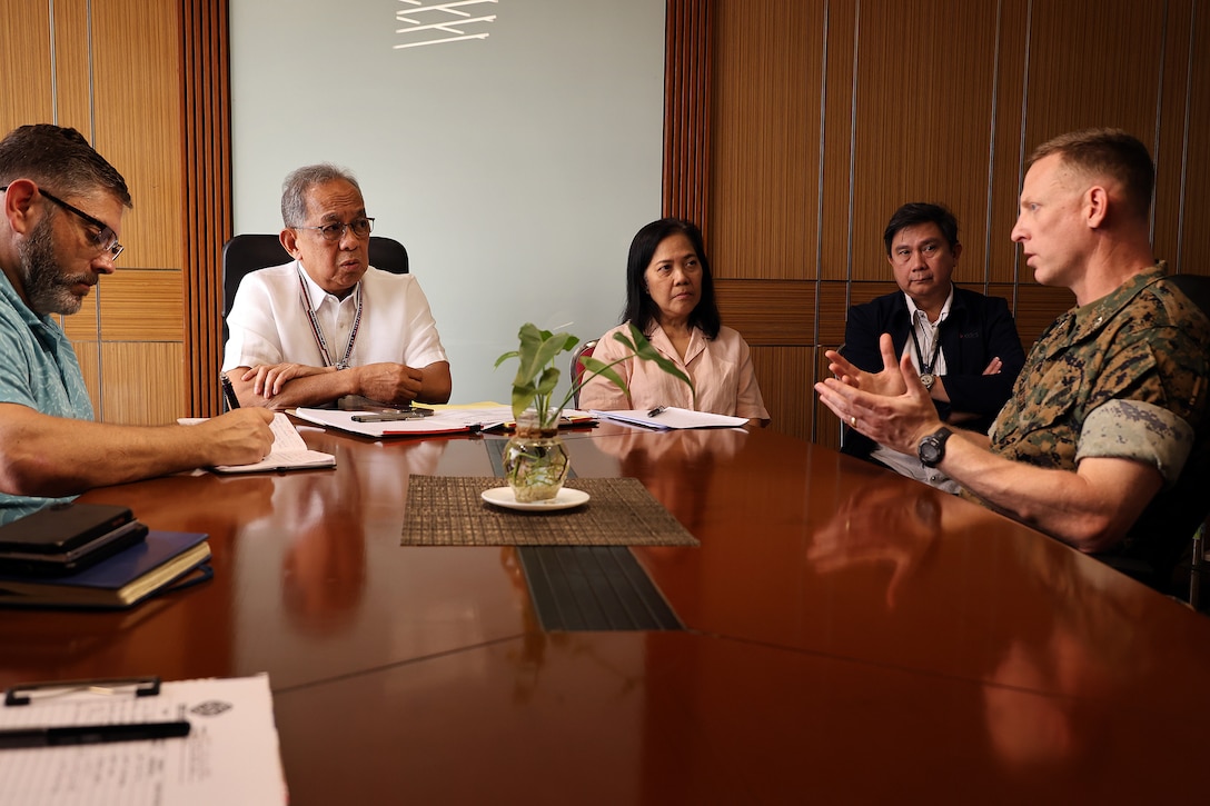 Eduardo Jose Aliño, chairman and administrator of Subic Bay Metropolitan Authority, discusses port operations Feb. 3 with U.S. Marine Corps Col. Luke Watson. Watson, commanding officer of Blount Island Command, visited Aliño’s office in Subic Bay Freeport Zone to discuss efficiencies needed for a sustainable logistics node. Blount Island Command plans to stage humanitarian aid and disaster relief equipment for the Indo-Pacific region. Part of the Marine Corps’ global prepositioning network, the ashore program will include engineering, communications and motor transportation assets. Aliño, a Philippine presidential appointee tasked with leading social and economic development in the zone, expressed support for efficient equipment transport at the bay located northwest of Manila. Blount Island Command, based in Jacksonville, Florida, is the hub for Marine Corps prepositioning programs, including afloat squadrons and ashore sites.