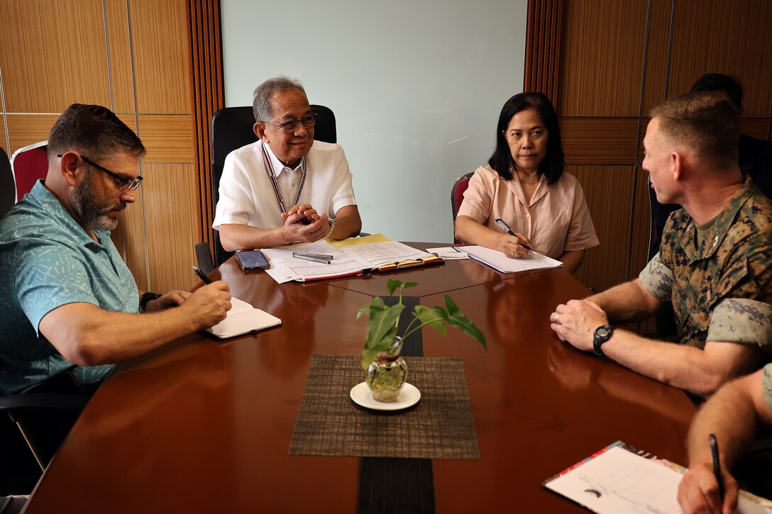 Eduardo Jose Aliño, chairman and administrator of Subic Bay Metropolitan Authority, discusses port operations Feb. 3 with U.S. Marine Corps Col. Luke Watson. Watson, commanding officer of Blount Island Command, visited Aliño’s office in Subic Bay Freeport Zone to discuss efficiencies needed for a sustainable logistics node. Blount Island Command plans to stage humanitarian aid and disaster relief equipment for the Indo-Pacific region. Part of the Marine Corps’ global prepositioning network, the ashore program will include engineering, communications and motor transportation assets. Aliño, a Philippine presidential appointee tasked with leading social and economic development in the zone, expressed support for efficient equipment transport at the bay located northwest of Manila. Blount Island Command, based in Jacksonville, Florida, is the hub for Marine Corps prepositioning programs, including afloat squadrons and ashore sites.