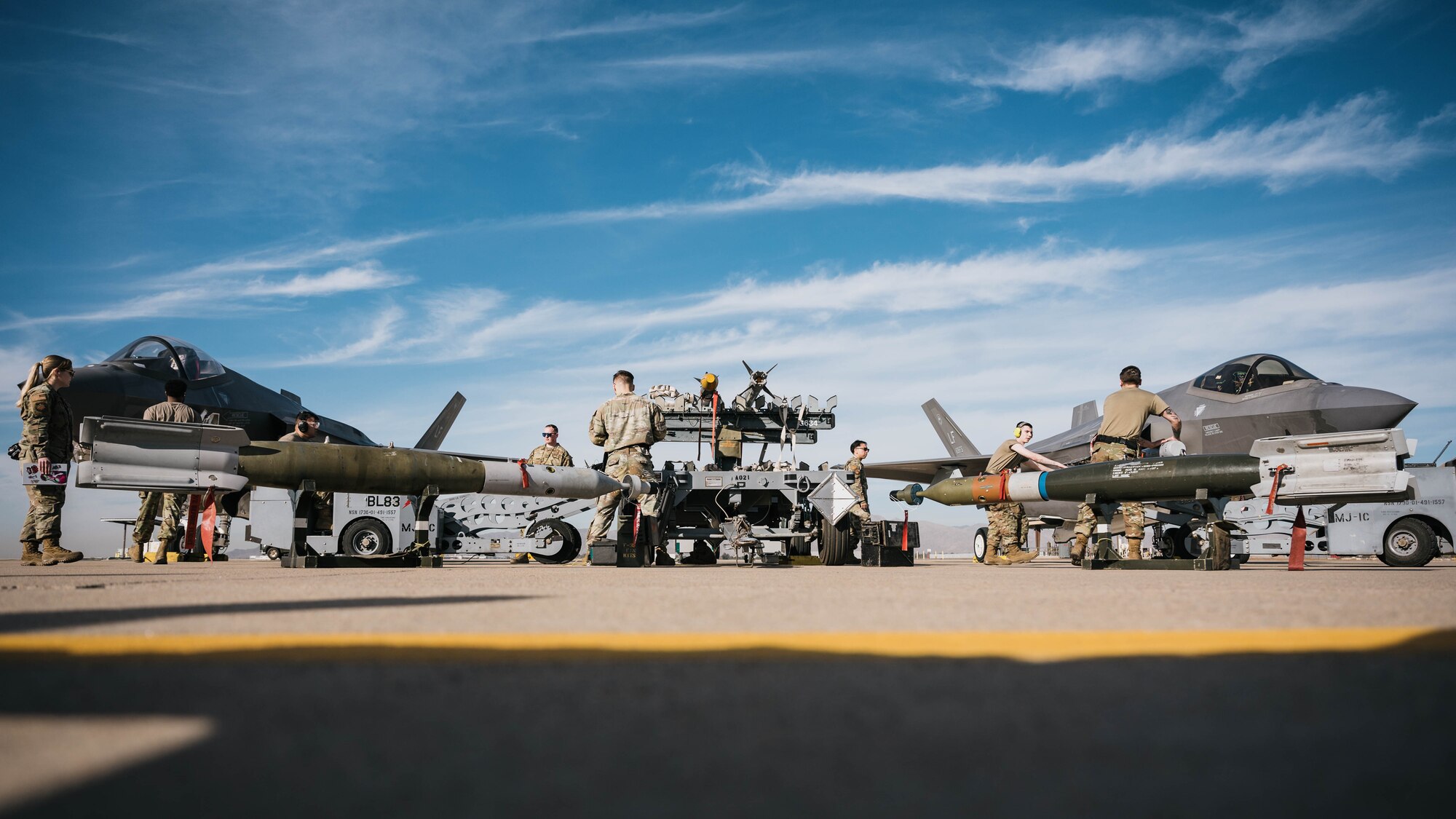 U.S. Air Force Airmen assigned to the 62nd Aircraft Maintenance Unit and the 310th Fighter Squadron participate in the annual weapons load competition.