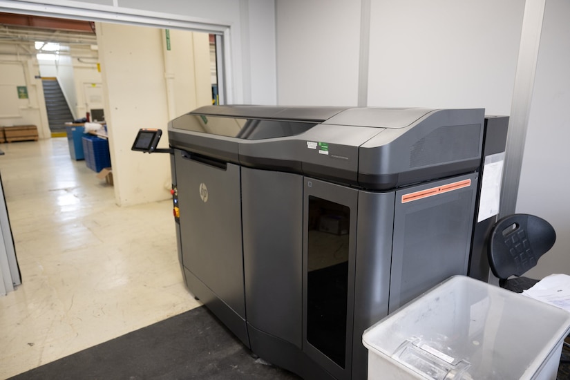 A large piece of printing equipment sits in a room.