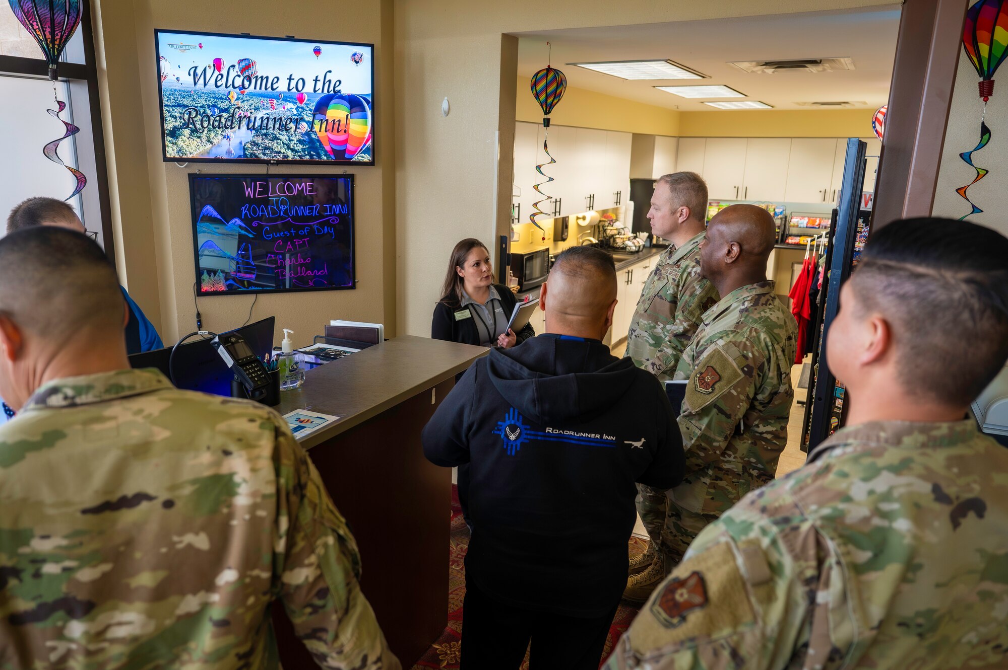 Leadership from the 377th Air Base Wing speak with staff members at the Roadrunner Inn during a lodging tour at Kirtland Air Force Base, N.M., Feb. 10.