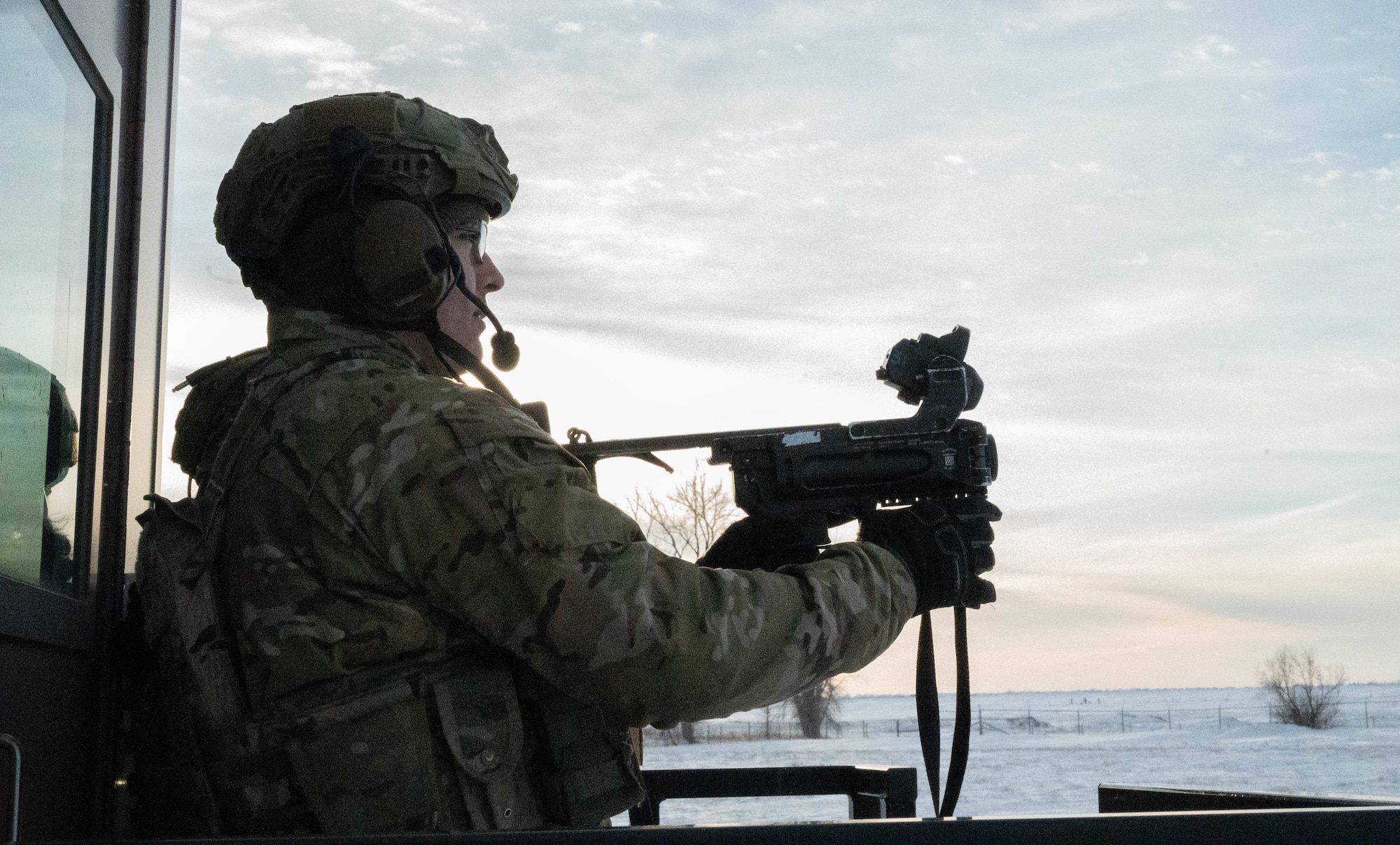 Senior Airman Jose Diaz, 91st Missile Security Operations Squadron defender, fires an M320A1 Grenade Launcher at Minot Air Force Base, North Dakota, Jan. 30, 2025. The M320A1 Grenade Launcher can be loaded with several types of ammunition depending on the situation. The M320A1 can also be mounted to another weapon to provide a more versatile weapon. (U.S. Air Force photo by Airman 1st Class Wesley Davies)
